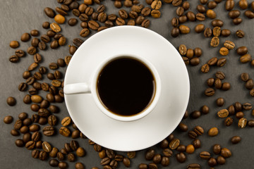 Obraz na płótnie Canvas white black Cup of coffee on a black background.