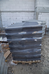 stack of concrete roof tile (gray color) at construction site