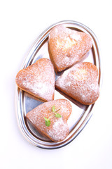 muffins in the form of heart with powdered sugar