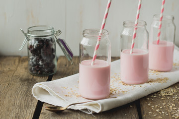 Tree jars with milk cocktail and straws
