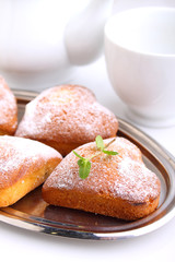 muffins in the form of heart with powdered sugar