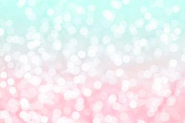 Colorful background with natural bokeh texture and defocused sparkling lights. Turquoise and pink texture with background with twinkling lights. Vintage and pastel colors