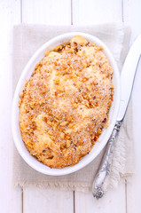 cake with apples, nuts and cinnamon on a white background