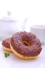 donuts with chocolate icing on a white background