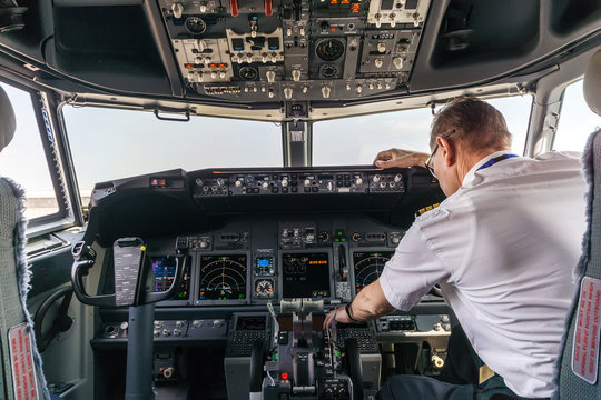 Pilot in the cockpit of a passenger plane