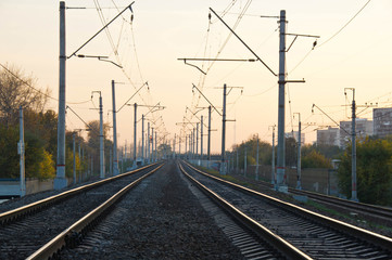 railroad tracks on a bridge in the city