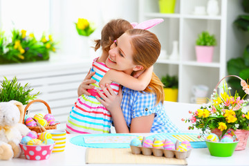 happy family celebrating Easter. mother and daughter hugging at