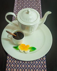 coffee cup with white dish on the table