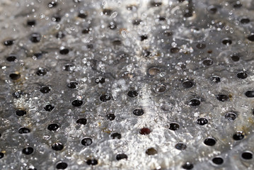chromed metal in water drops