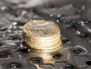 coins in a spray of water