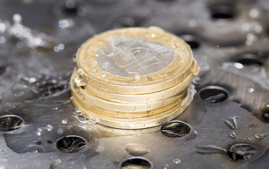 coins in a spray of water