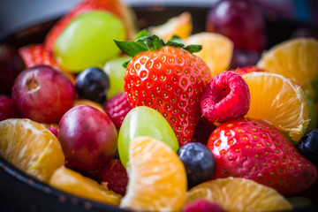 dish full various fresh colorful fruits