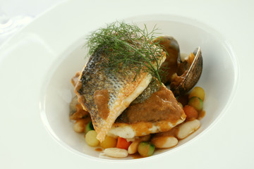 sea bass fish with beans plated meal