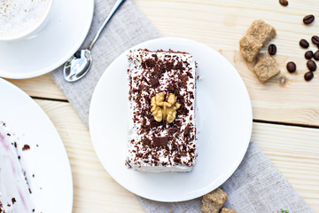 Delicious chocolate cake on plate on table on light background