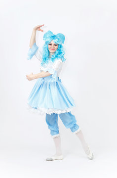 Theatre actress in fairy tale costume of alive doll on white