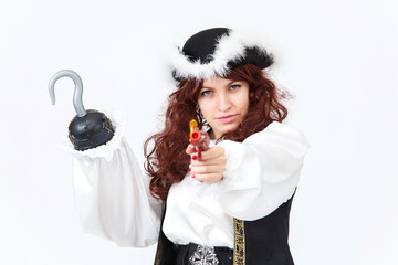 Beautiful actress in pirate costume with pistol and hook