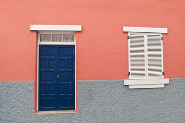 traditional spanish home facade with pink wall