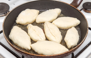 Food patties in a frying pan