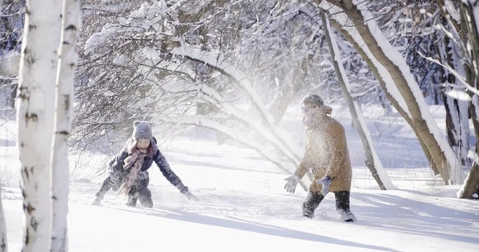 Winter snowball fight between young people