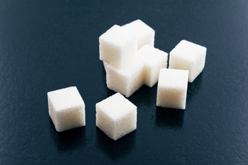 Lump sugar on a blue background