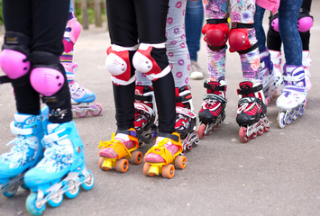 Children on the street in the Summer on roller skates