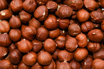 Fine hazelnuts close up background