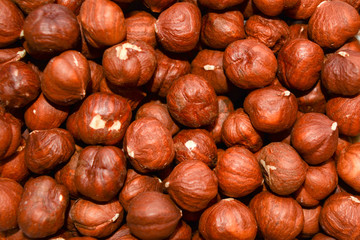 Fine hazelnuts close up background