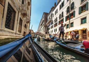 Fototapeta na wymiar View from gondola during the ride through the canals of Venice i