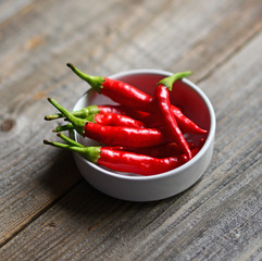 Chilli pepper on the wooden background