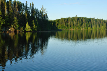 Fototapeta na wymiar Reflections on a Wilderness Lake