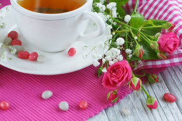 Cup of tea and roses