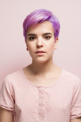 Violet-short-haired woman in pink pastel.