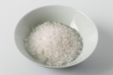 white salt in the cup