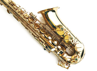 Golden saxophone isolated on white background, close up