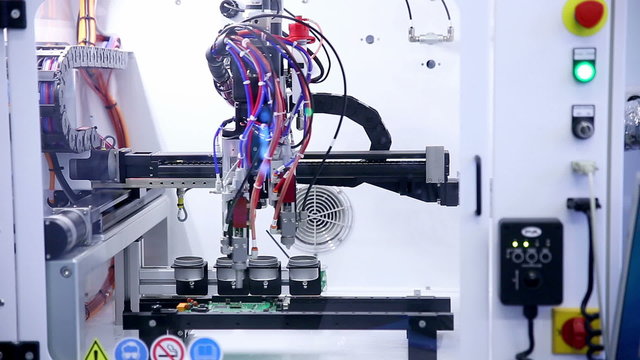 Surface Mount Technology Smt Machine places elements on circuit boards. HD.