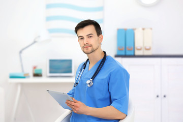 Doctor with tablet in office