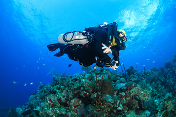 Naklejka na ściany i meble Closed Circuit Rebreather Diver on a Coral Reef