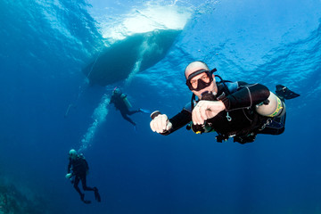 Sidemount SCUBA Diving below a dive boat