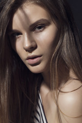 Fototapeta premium Portrait of a beautiful girl in the studio close-up, beauty concept