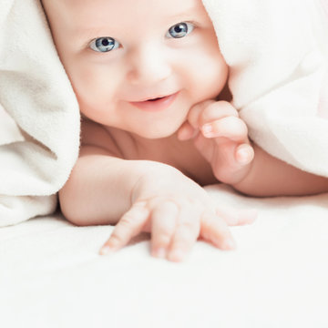 Happy baby after bathing looking at you