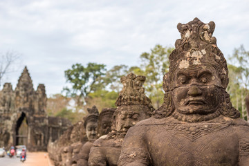Fototapeta na wymiar Statue at gate of Angkor Thom , Siem Reap , Cambodia