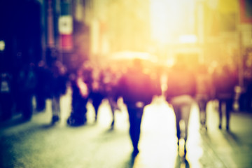 people walking in the street, blurry