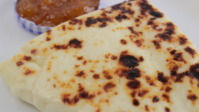Lapland cheese with cloudberry jam on a white plate