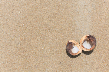 Fototapeta na wymiar Opened coconut on the sand