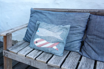 old timber bench with cushion
