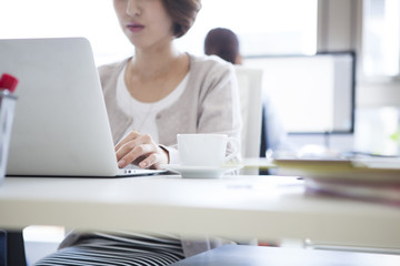 Fototapeta premium Women are at work with a laptop in the office