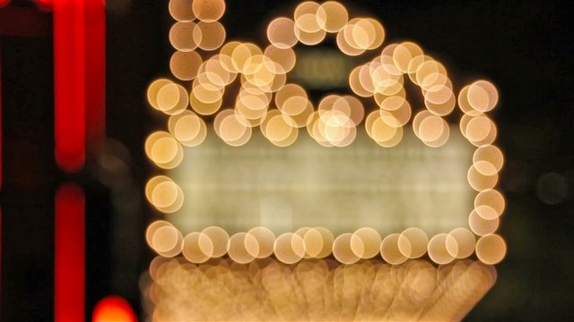 High definition movie of blinking out of focus blurred bokeh concert hall theater lights on broadway along a entertainment street 1080p