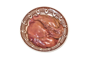 Liver in a ceramic plate. Isolated on white background