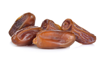 pile of date palm fruit on white background