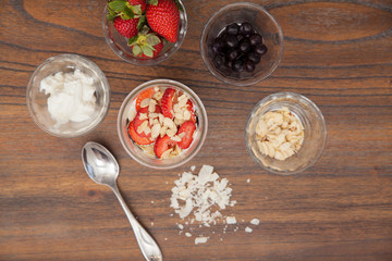 Yogurt with fruit, nuts and coconut